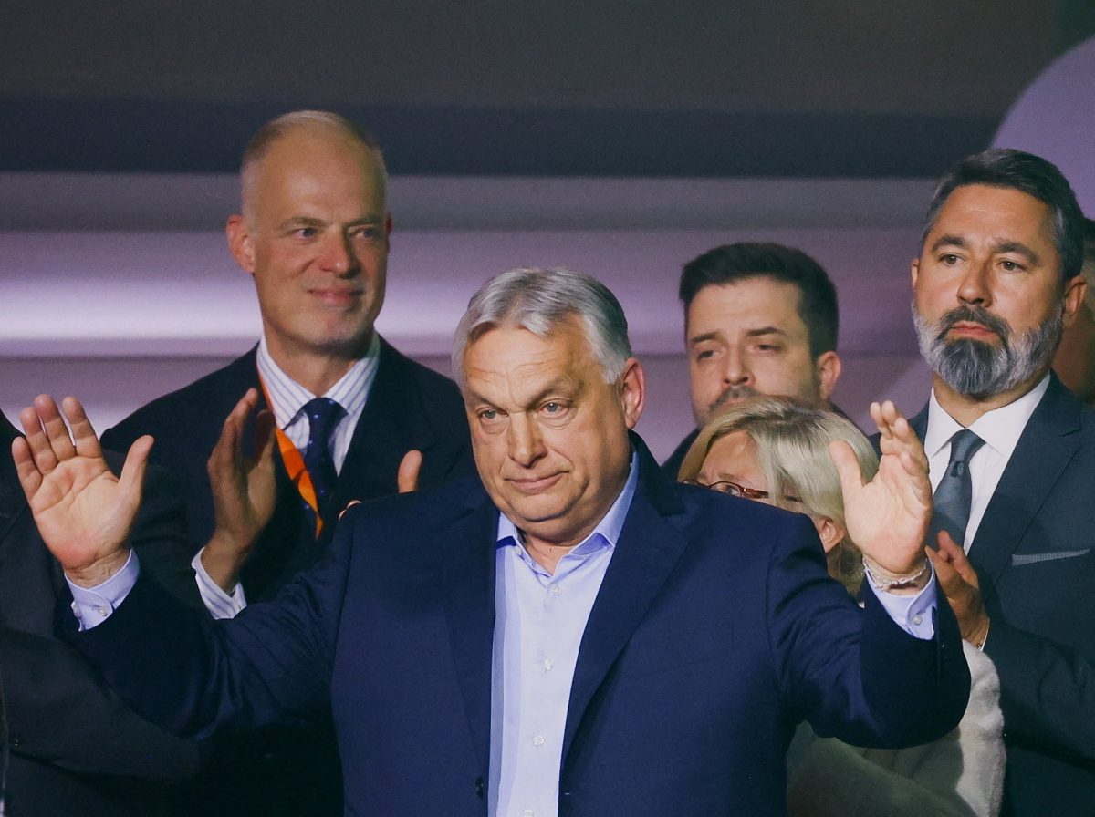 Hungarian Prime Minister Viktor Orban reacts onstage as people applaud after the announcement of the partial results of parliamentary election in Budapest, Hungary, April 12, 2026. REUTERS/Bernadett Szabo